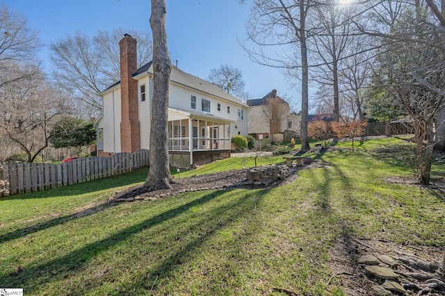 view of yard with a sunroom