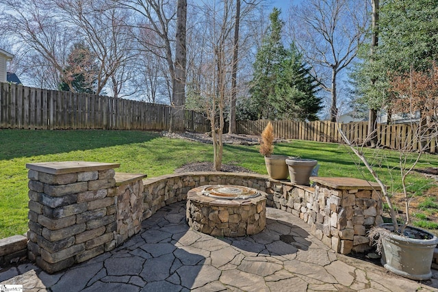 view of patio with an outdoor fire pit