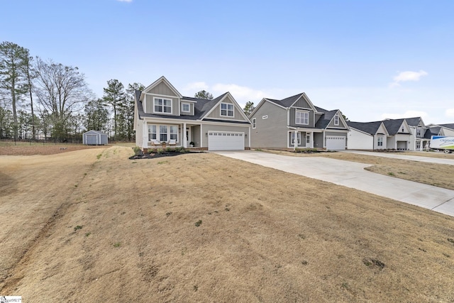 traditional-style home featuring driveway, an outdoor structure, a storage unit, a garage, and board and batten siding