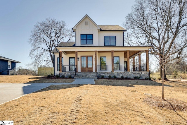 view of front of home with central air condition unit, covered porch, and french doors