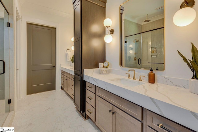 bathroom with crown molding, an enclosed shower, and vanity