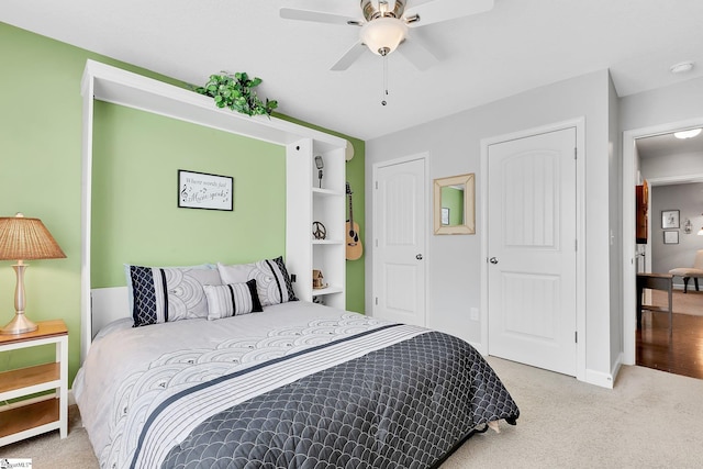 carpeted bedroom with ceiling fan