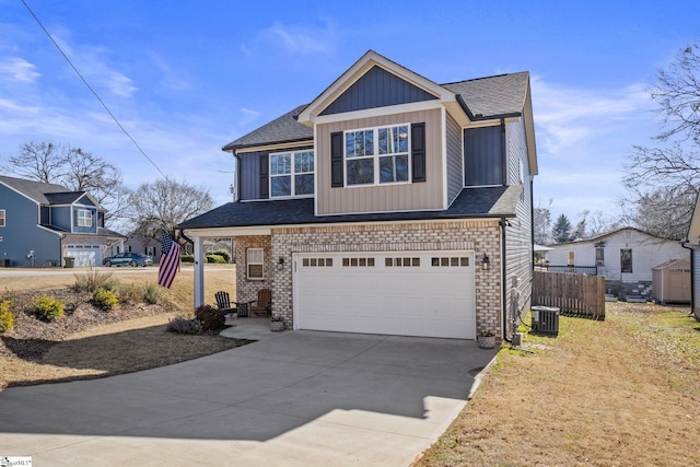 view of front of home featuring a garage and central air condition unit