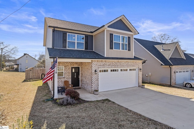 view of front of house with a garage and a front lawn