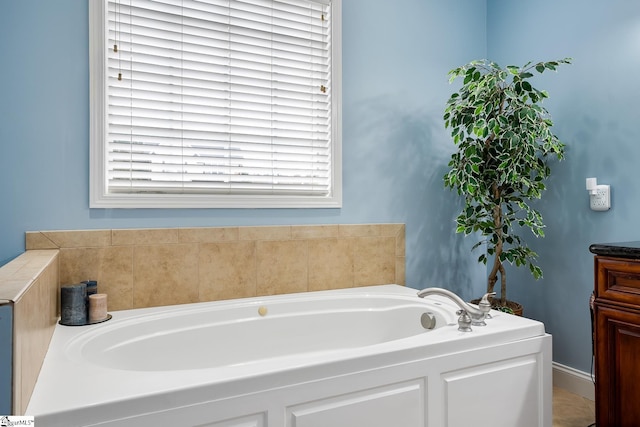 bathroom featuring vanity and a bathing tub