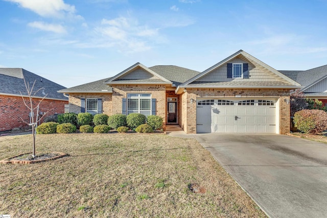 view of front of house with a garage and a front lawn