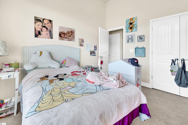 carpeted bedroom with a closet