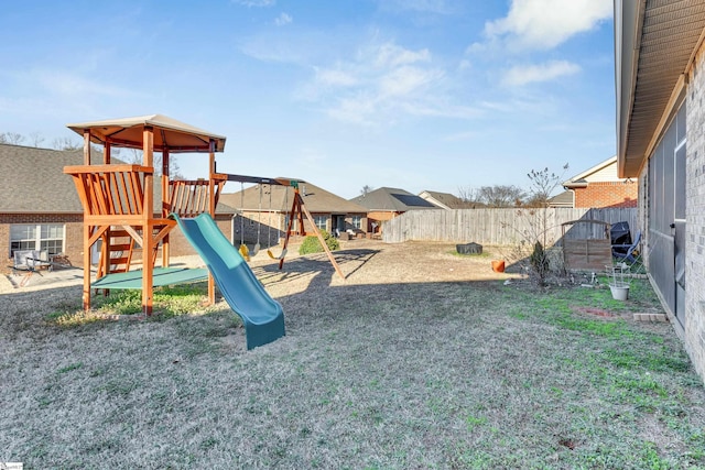 view of jungle gym featuring a lawn