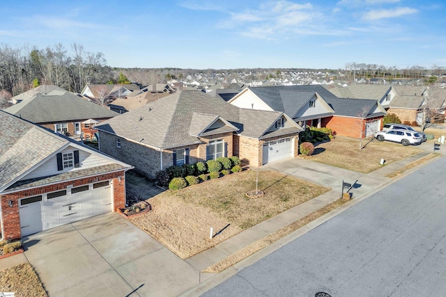 view of front of property featuring a garage and a front yard