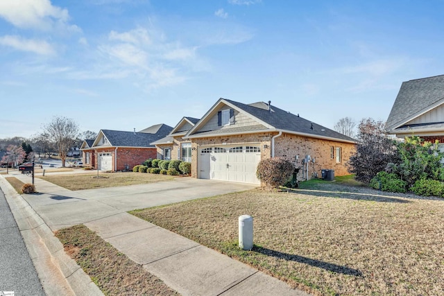 view of front of home featuring a garage and a front lawn