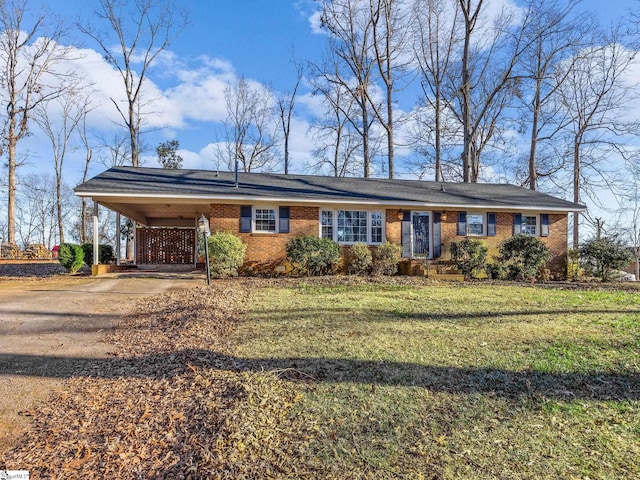 ranch-style house with a carport and a front lawn