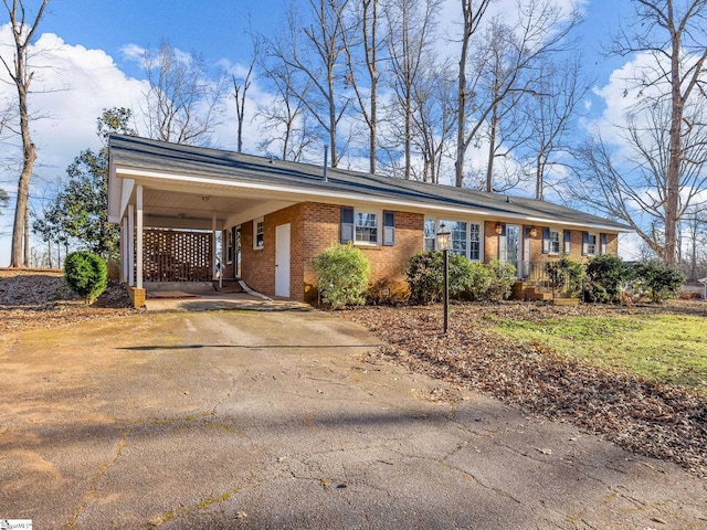 ranch-style home with a carport