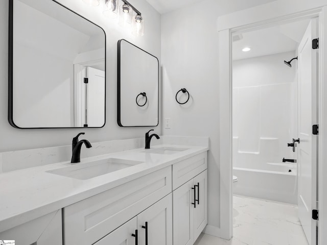 full bathroom with shower / washtub combination, vanity, and toilet