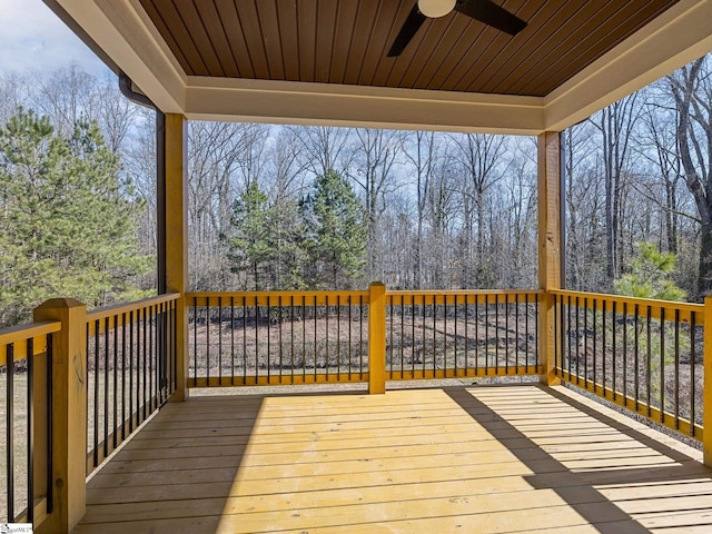 wooden terrace featuring ceiling fan