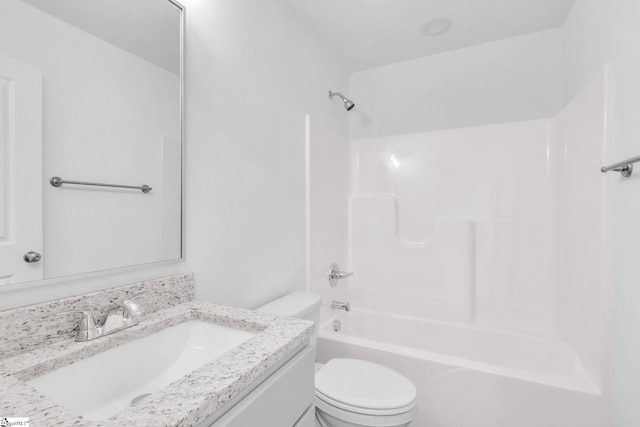 full bathroom featuring vanity, washtub / shower combination, and toilet