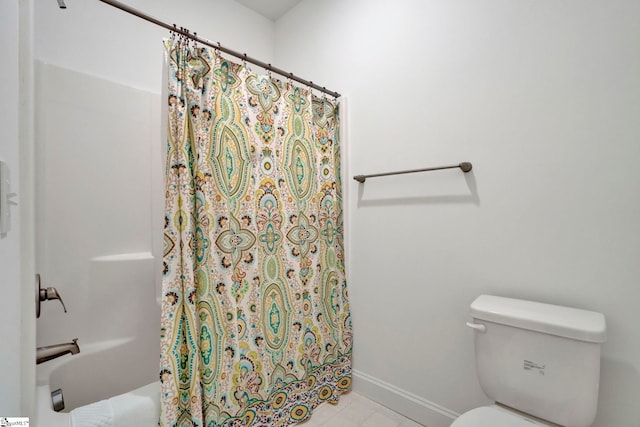 bathroom with toilet and a shower with shower curtain