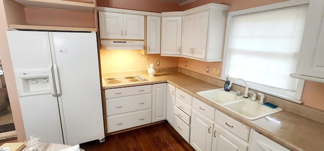 kitchen featuring sink, white appliances, dark hardwood / wood-style floors, and white cabinets