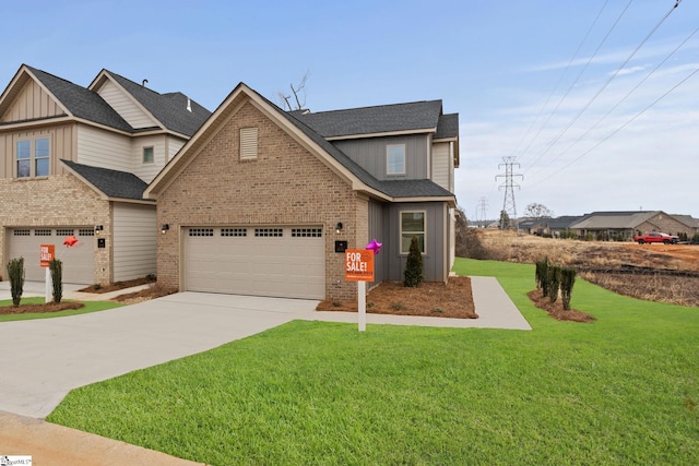 view of front of home featuring a garage and a front yard