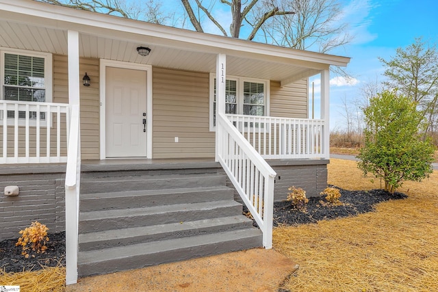 doorway to property featuring a porch