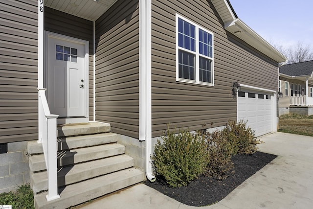 property entrance with a garage