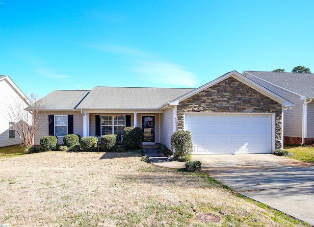 single story home featuring a garage and a front lawn