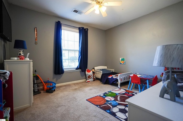 carpeted bedroom with ceiling fan