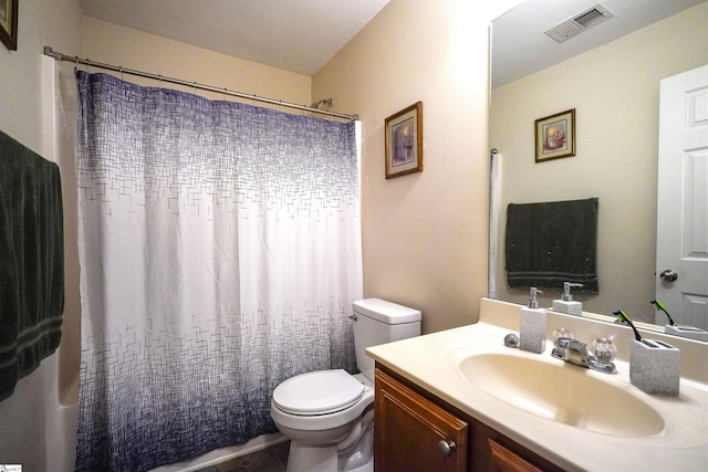 bathroom with vanity, a shower with curtain, and toilet