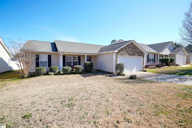 ranch-style home with a garage and a front yard