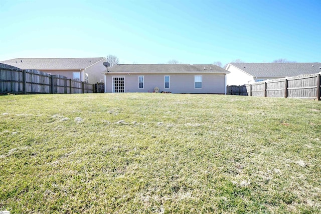 back of house featuring a yard