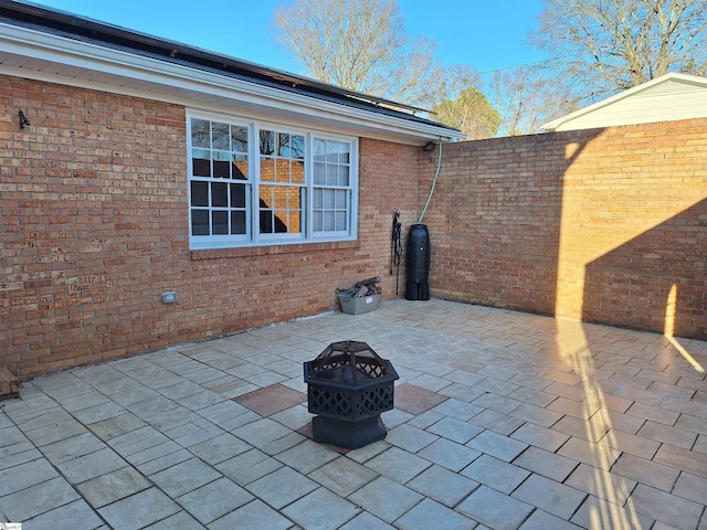 view of patio / terrace with an outdoor fire pit