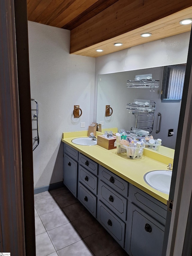 full bathroom with tile patterned floors, wood ceiling, double vanity, and a sink