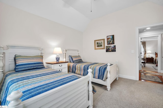 carpeted bedroom with vaulted ceiling