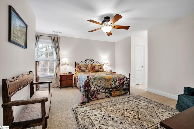 bedroom with light colored carpet and ceiling fan