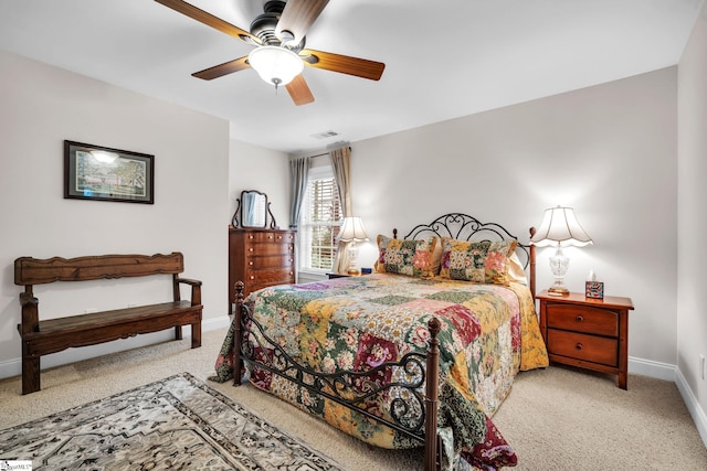 bedroom featuring ceiling fan and carpet