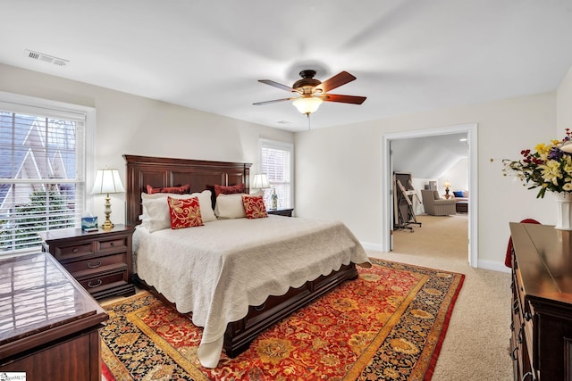 bedroom with light colored carpet and ceiling fan