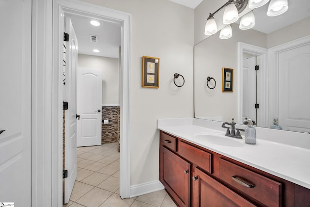 bathroom with tile patterned flooring and vanity