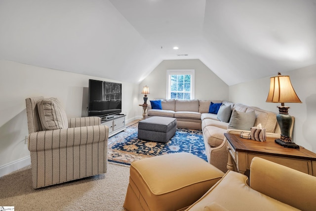 living room featuring vaulted ceiling and carpet