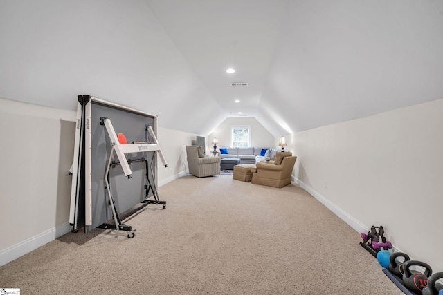 exercise area featuring lofted ceiling and carpet flooring