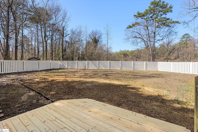 view of yard featuring a wooden deck