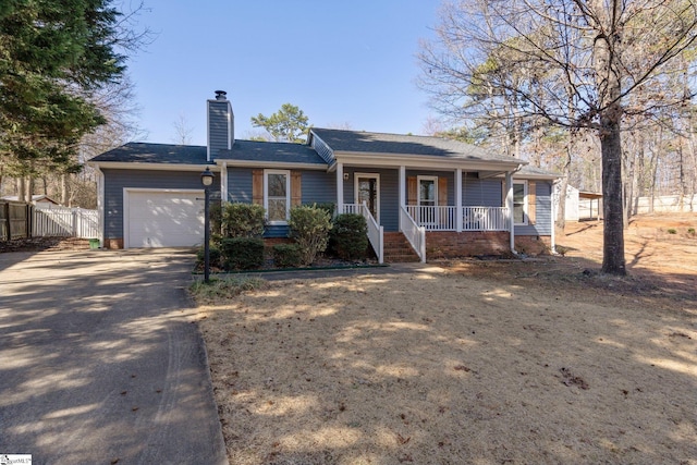 ranch-style home featuring a garage and covered porch