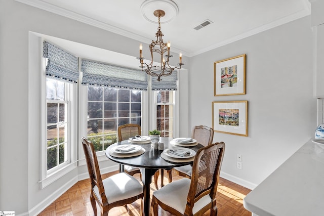 dining area featuring an inviting chandelier, parquet flooring, and ornamental molding