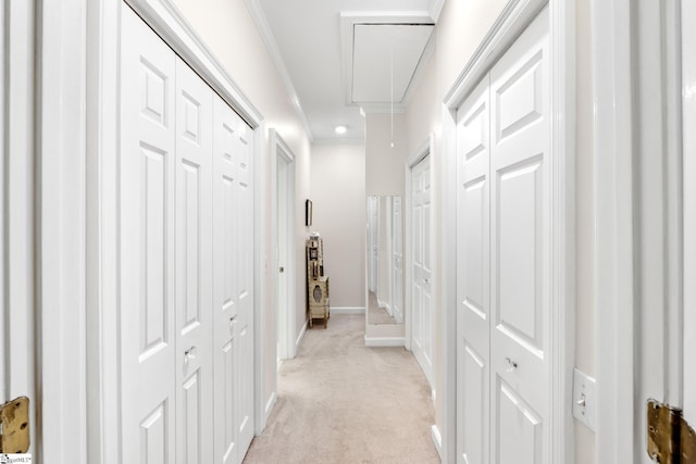 hall featuring light carpet and ornamental molding