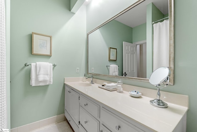 bathroom featuring tile patterned flooring and vanity