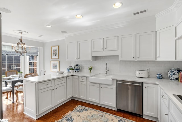 kitchen featuring white cabinetry, sink, pendant lighting, and dishwasher