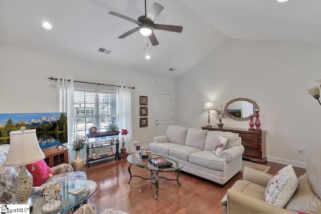 living room featuring wood-type flooring, high vaulted ceiling, and ceiling fan