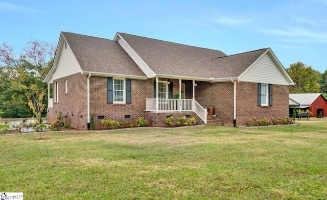 view of front of home featuring a front yard and covered porch