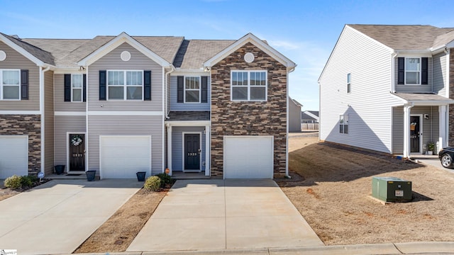 townhome / multi-family property featuring a garage