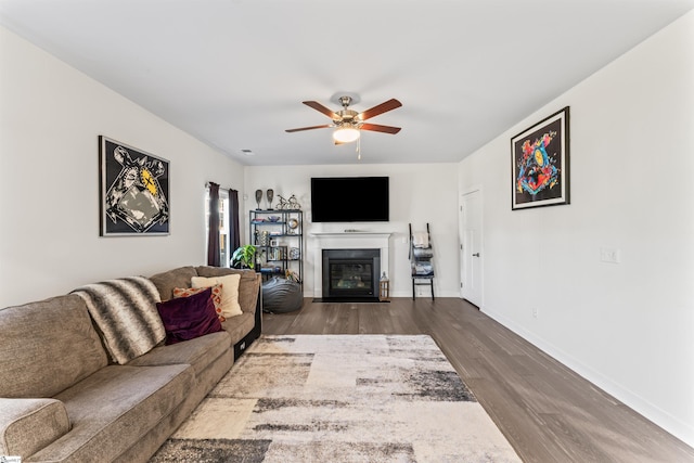 living room with wood-type flooring and ceiling fan