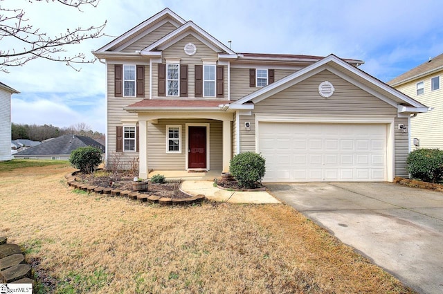 view of front of home with a garage and a front lawn