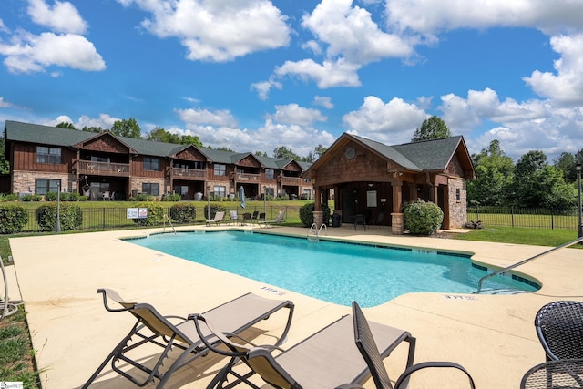 view of swimming pool with a patio